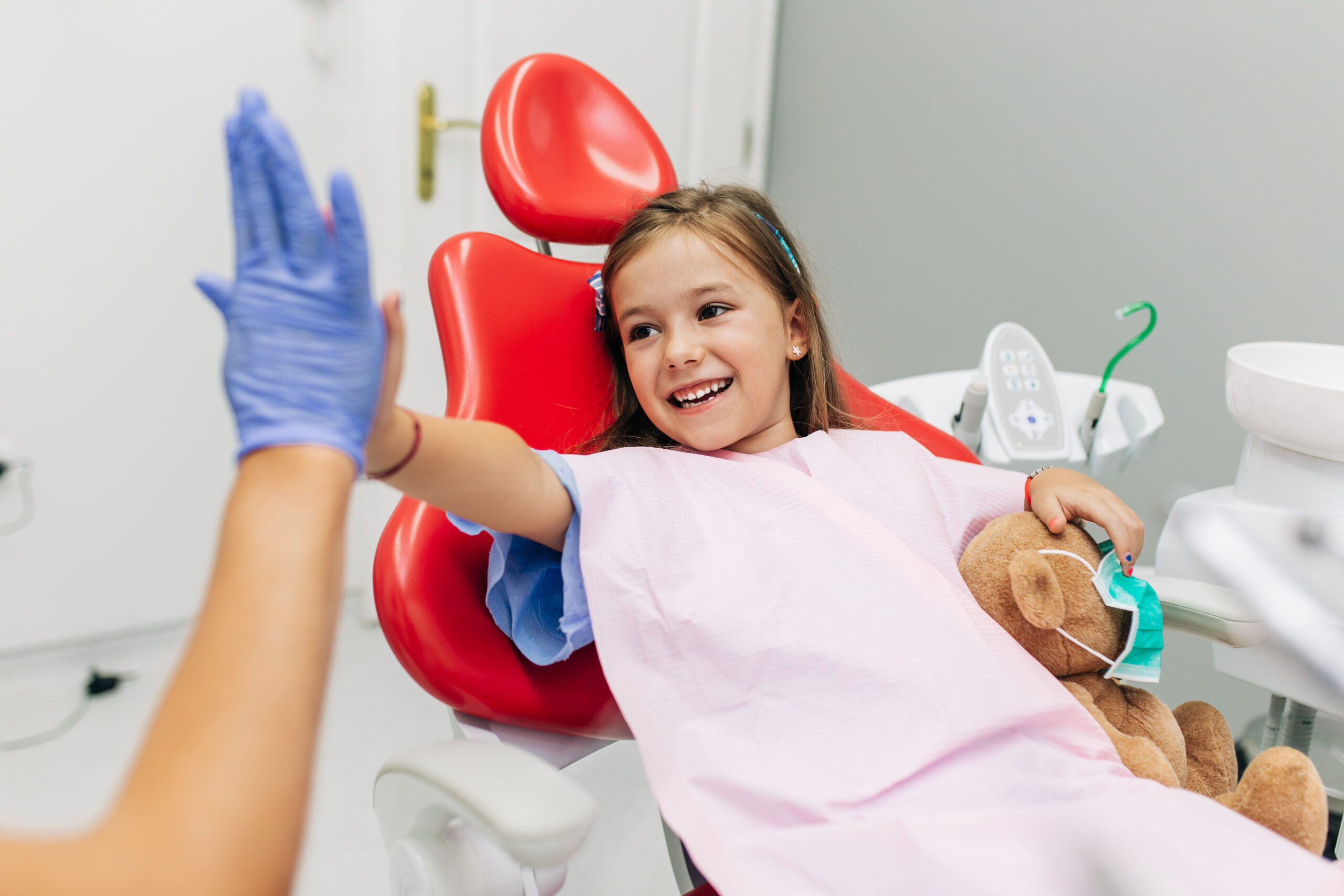 High Five between girl and dentist